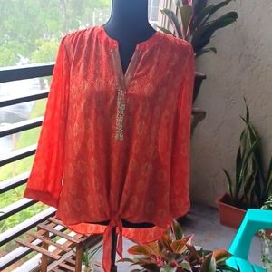 NWOT Chico's tie front blouse. Chico's size 1 is medium. Orange print, sequins